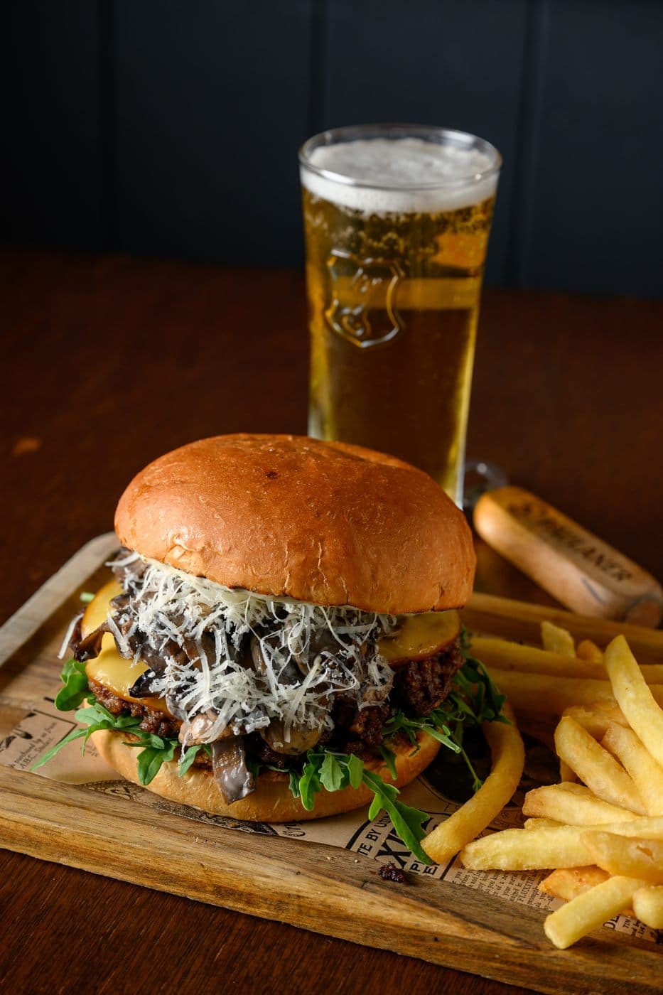 Truffle Parm burger with fries and a beer