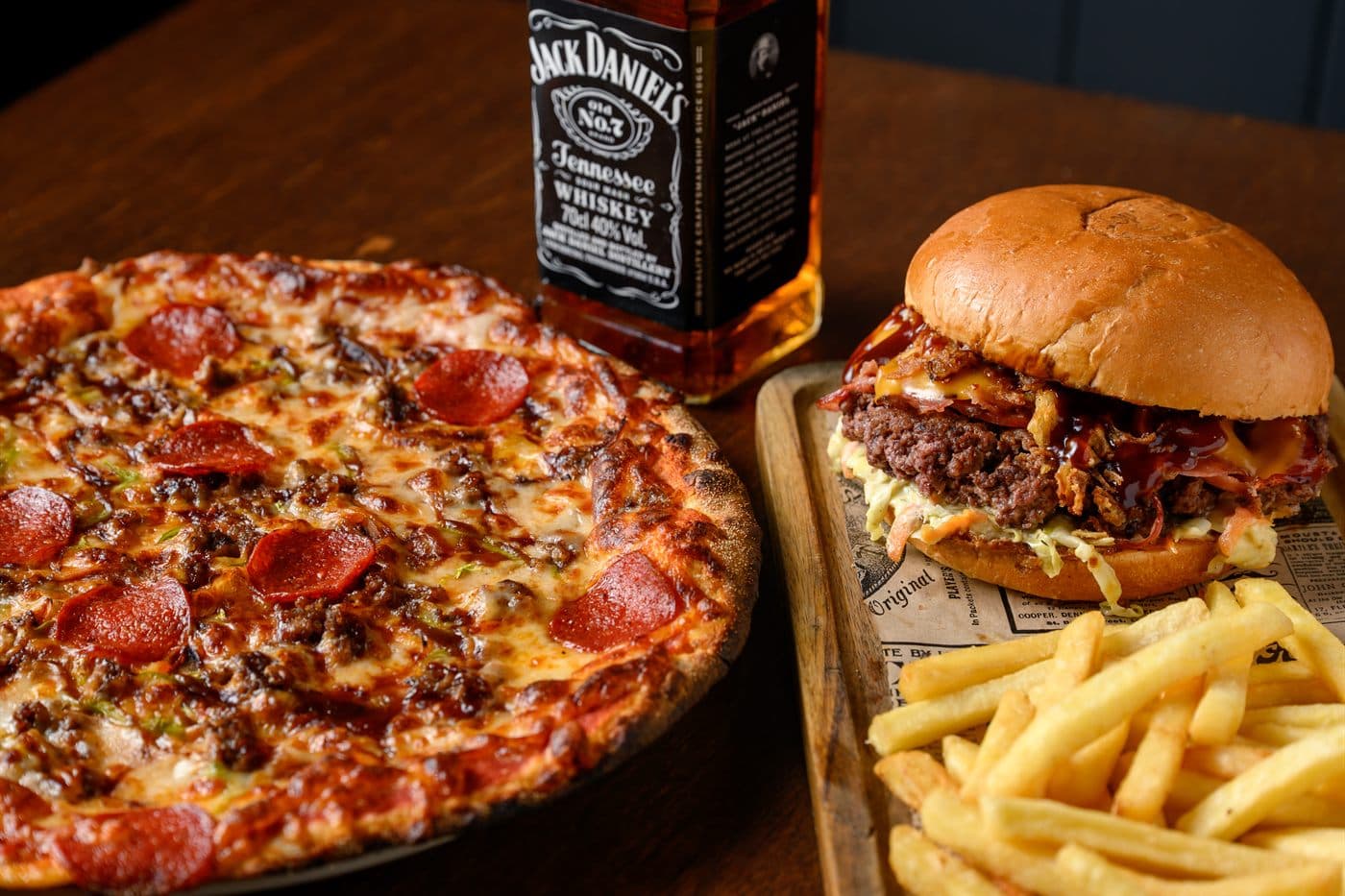 Beefy Jack pizza beside a burger and fries