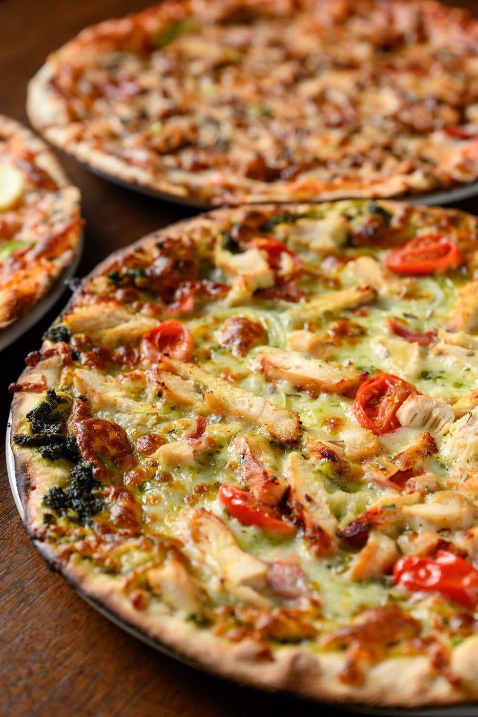 Two chicken pesto pizzas
