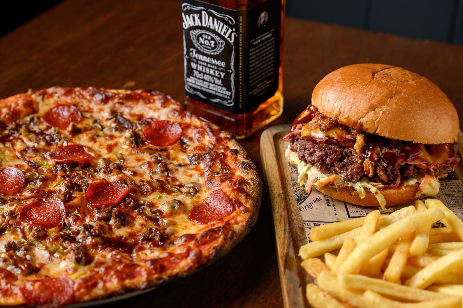 A Beefy Jack pizza served with a burger and fries